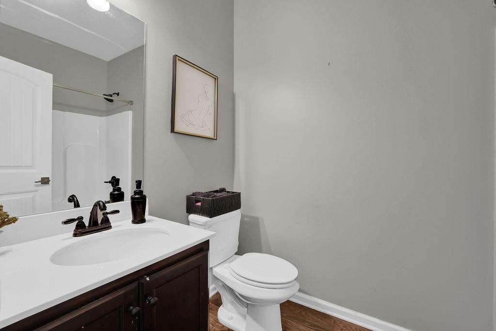 333 Nobleman Way Canton, GA 30114 - Photo 17 of 31 a bathroom with a sink and a toilet