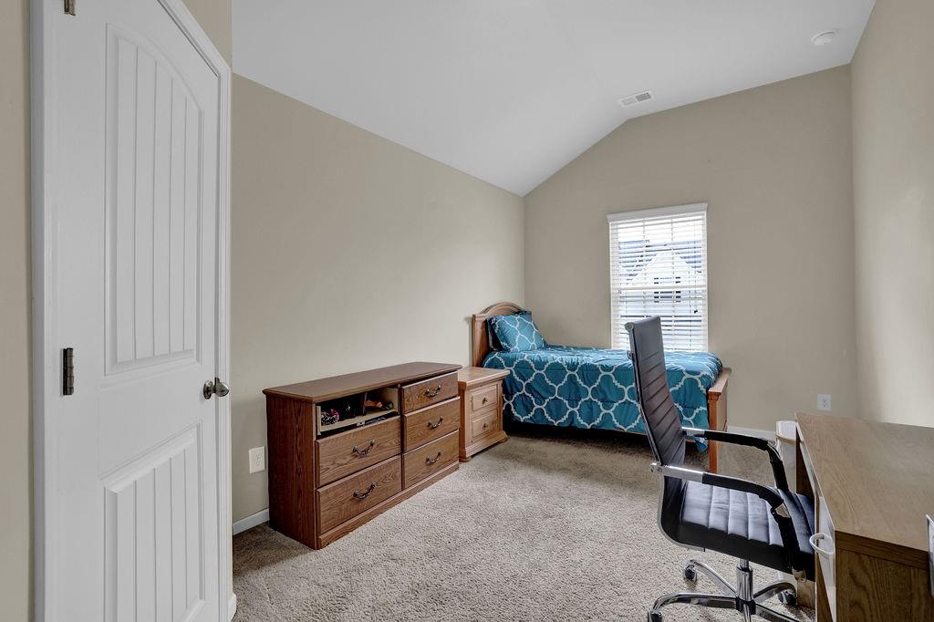 333 Nobleman Way Canton, GA 30114 - Photo 19 of 31 a bedroom with a bed and a window