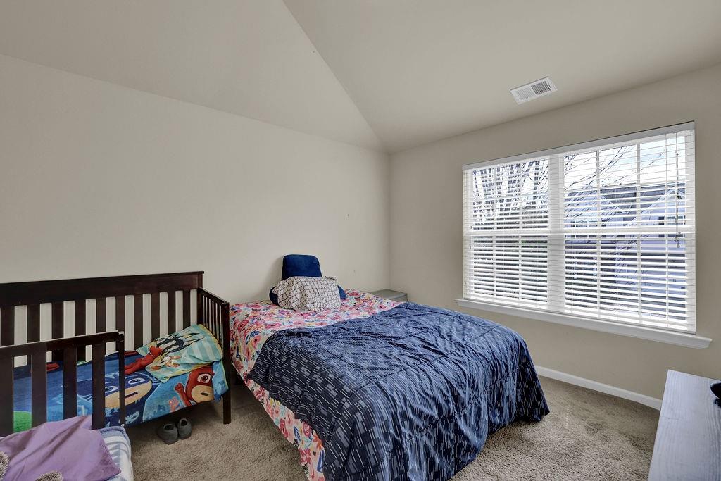 333 Nobleman Way Canton, GA 30114 - Photo 21 of 31 a bedroom with bed and a window