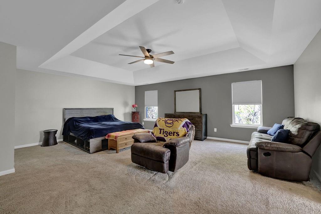 333 Nobleman Way Canton, GA 30114 - Photo 22 of 31 a living room with furniture and a ceiling fan