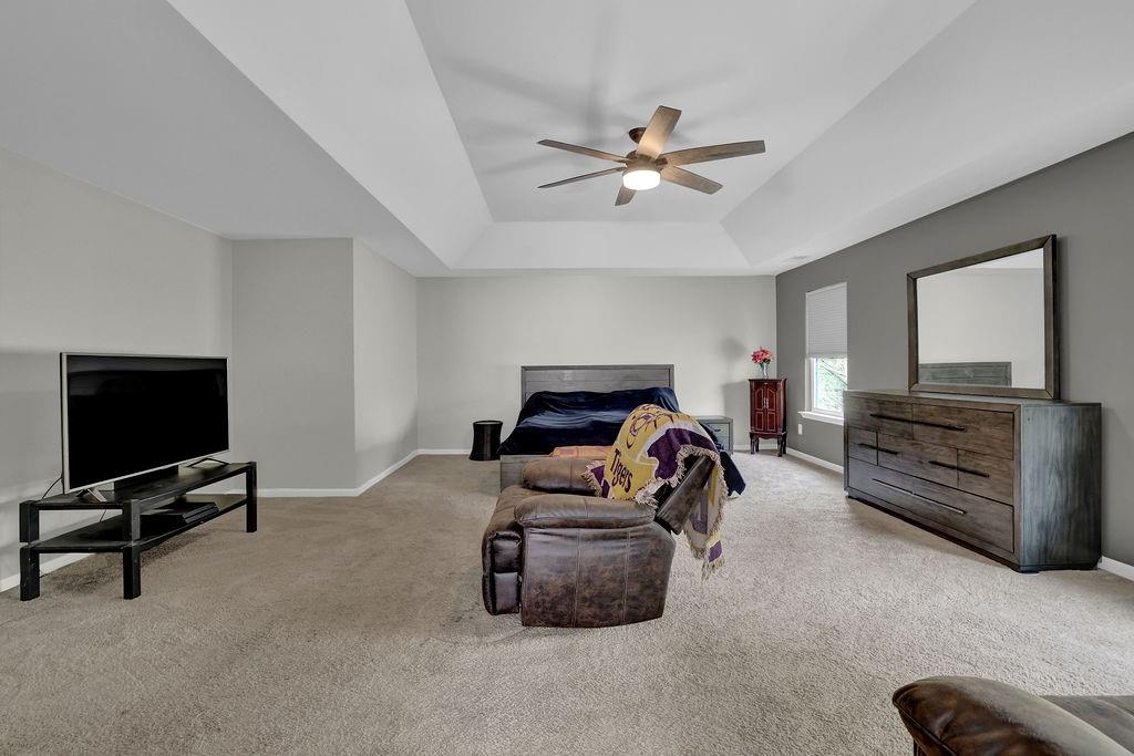 333 Nobleman Way Canton, GA 30114 - Photo 23 of 31 a bedroom with furniture and a flat screen tv