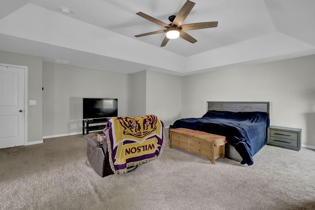 333 Nobleman Way Canton, GA 30114 - Photo 24 of 31 a living room with furniture and a flat screen tv