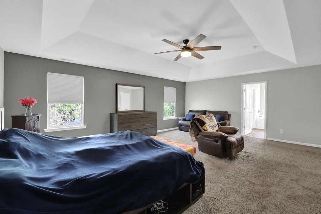 333 Nobleman Way Canton, GA 30114 - Photo 25 of 31 a bed room with a bed and a tv