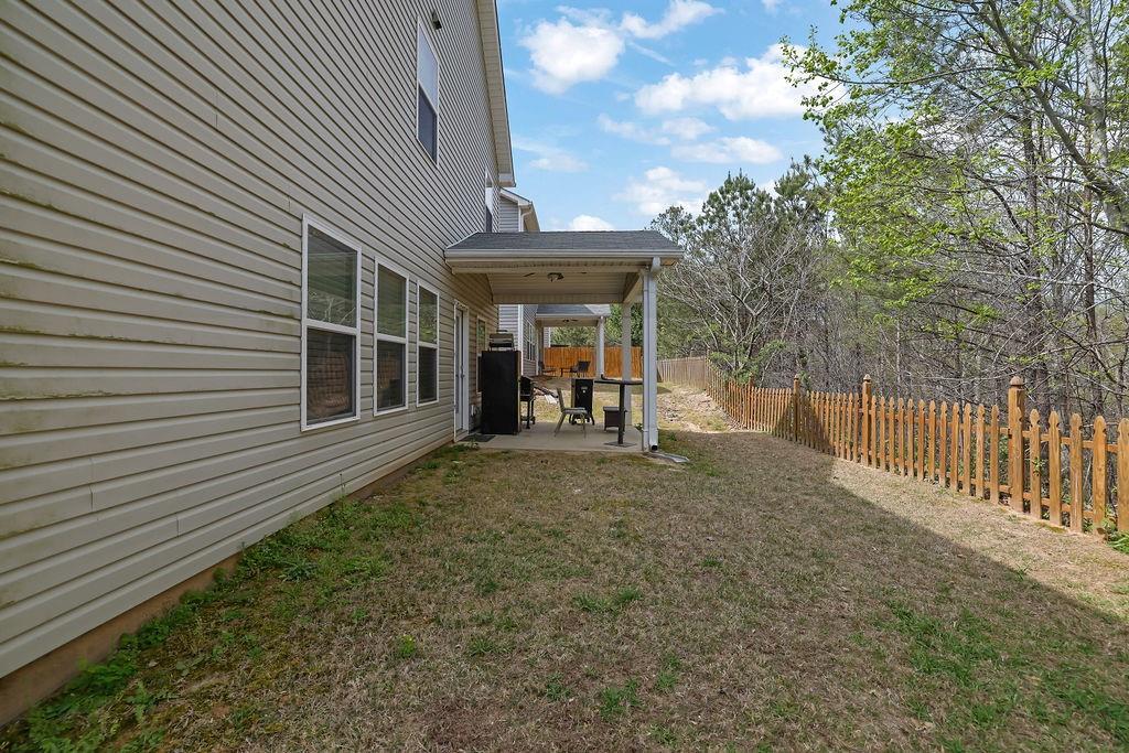 333 Nobleman Way Canton, GA 30114 - Photo 29 of 31 a view of a house with a backyard