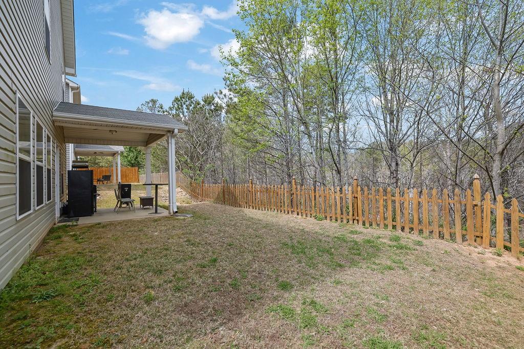 333 Nobleman Way Canton, GA 30114 - Photo 31 of 31 a view of a backyard with large trees