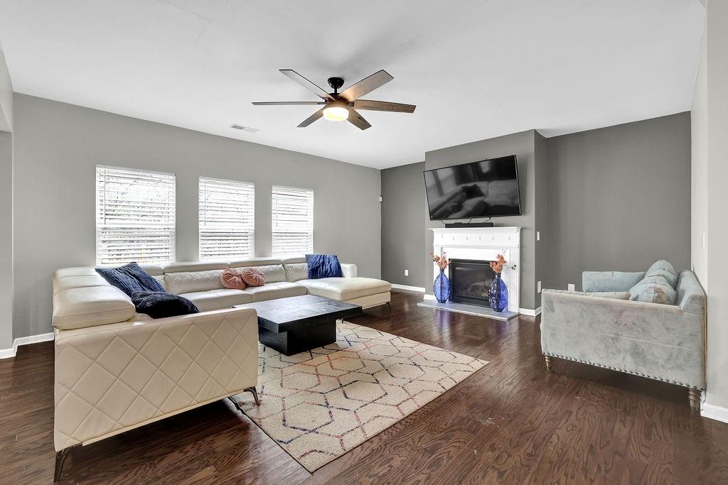 333 Nobleman Way Canton, GA 30114 - Photo 6 of 31 a living room with furniture fireplace and flat screen tv