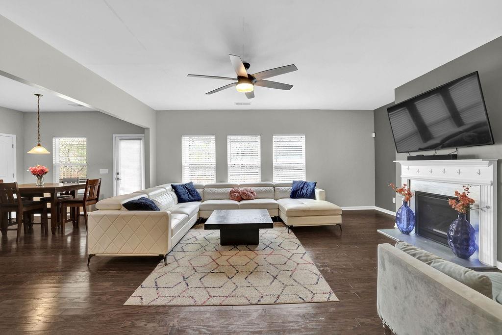 333 Nobleman Way Canton, GA 30114 - Photo 7 of 31 a living room with furniture fireplace and flat screen tv