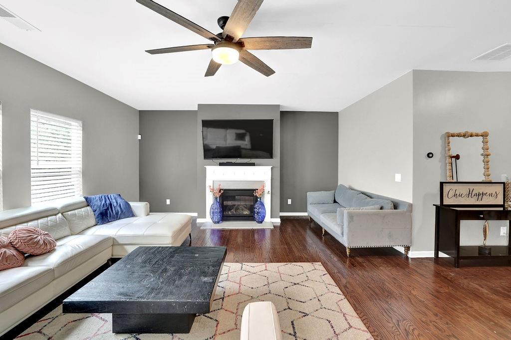 333 Nobleman Way Canton, GA 30114 - Photo 9 of 31 a living room with furniture fireplace and flat screen tv