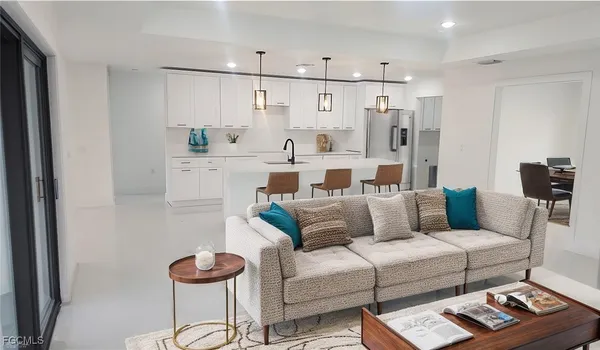 a living room with furniture and a table