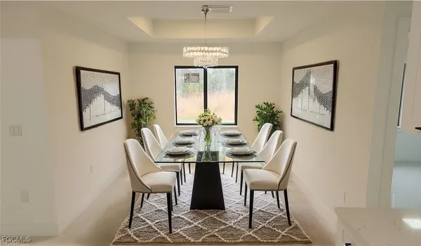 a view of a dining room with furniture and a chandelier