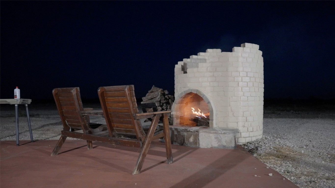 0 Ranch To Market 3008 Ranch Brackettville, TX 78832 - Photo 25 of 40 a workspace with furniture and a fireplace
