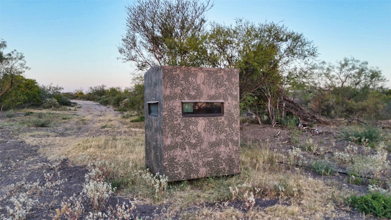 0 Ranch To Market 3008 Ranch Brackettville, TX 78832 - Photo 39 of 40 a view of a stone wall with large tree