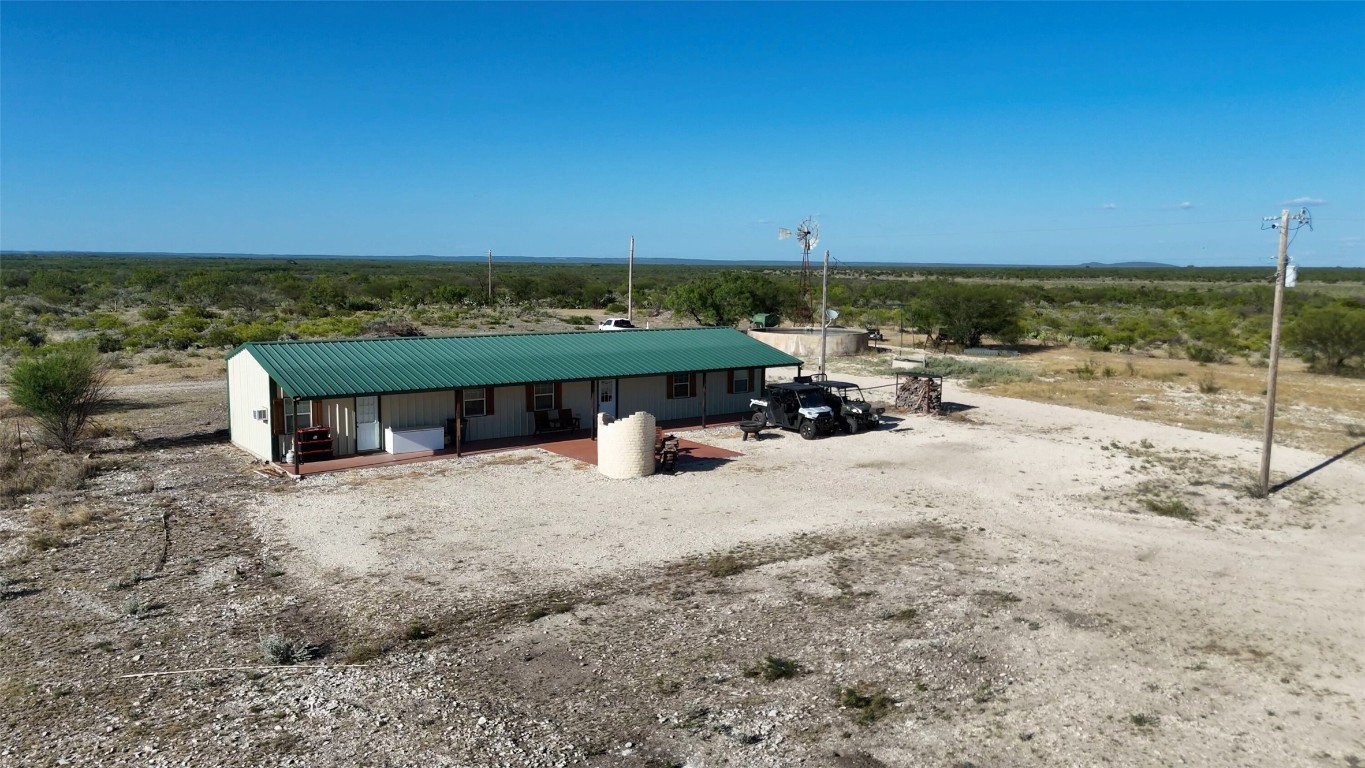 0 Ranch To Market 3008 Ranch Brackettville, TX 78832 - Photo 10 of 40 a dirt road with a building in the background