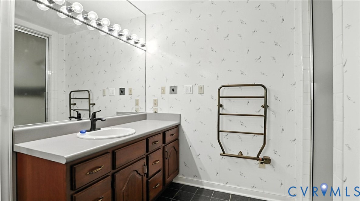 3321 Gloucester Road Richmond, VA 23227 - Photo 29 of 38 Bathroom with vanity, dark tile patterned floors,