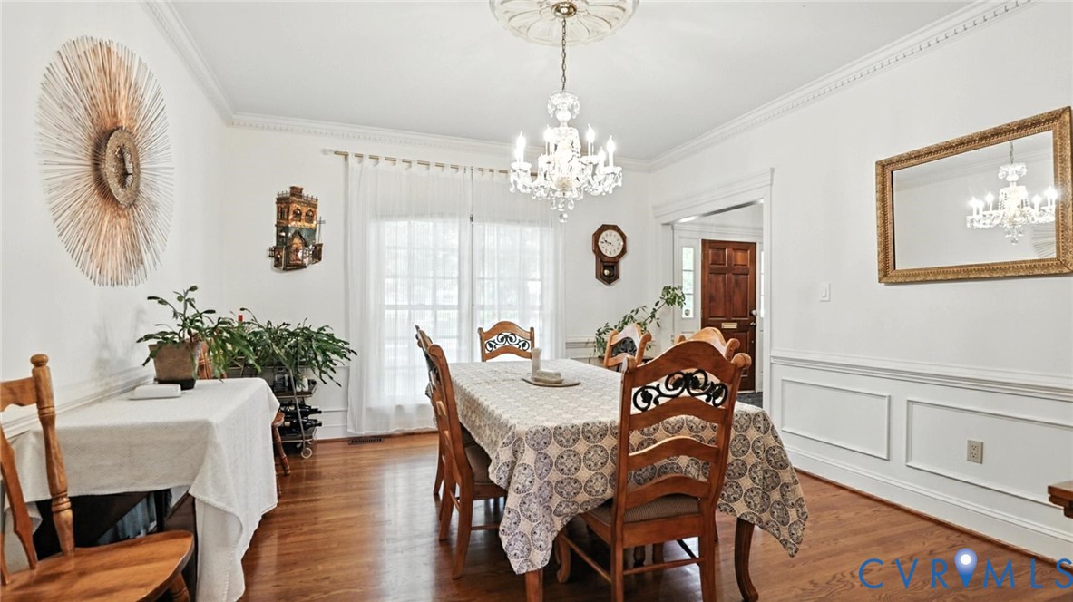 3321 Gloucester Road Richmond, VA 23227 - Photo 6 of 38 Dining area featuring ornamental molding, a chande