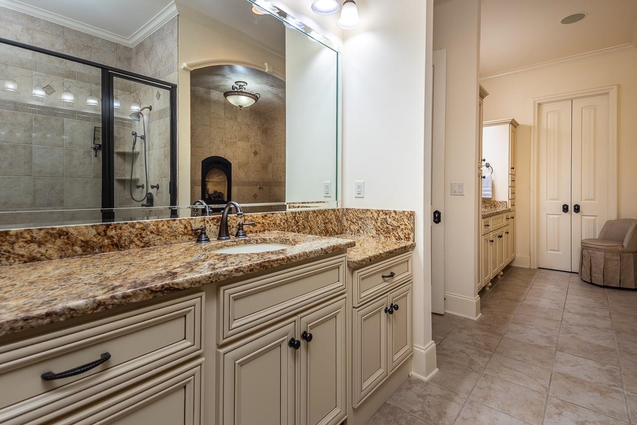 4600 Maple Glen Court Lakeland, TN 38002 - Photo 21 of 40 a spacious bathroom with a granite countertop sink a mirror and a