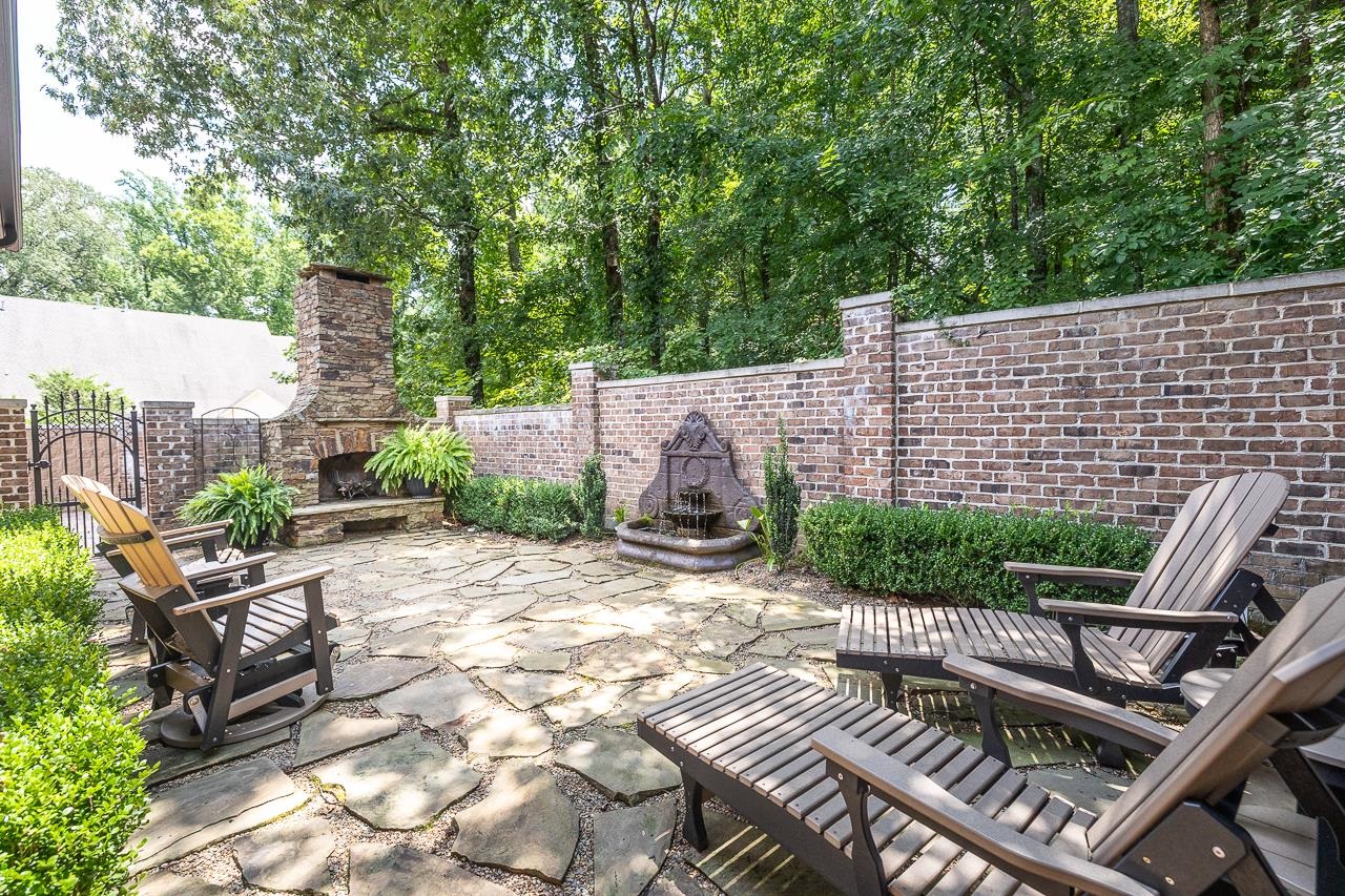 4600 Maple Glen Court Lakeland, TN 38002 - Photo 26 of 40 a view of an outdoor sitting area with brick walls