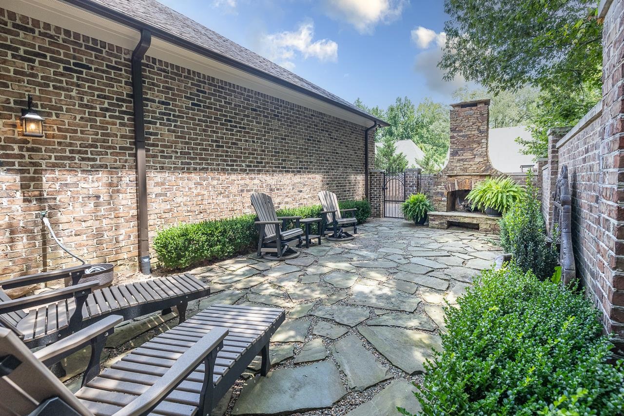 4600 Maple Glen Court Lakeland, TN 38002 - Photo 27 of 40 a view of a patio with table and chairs and potted plants