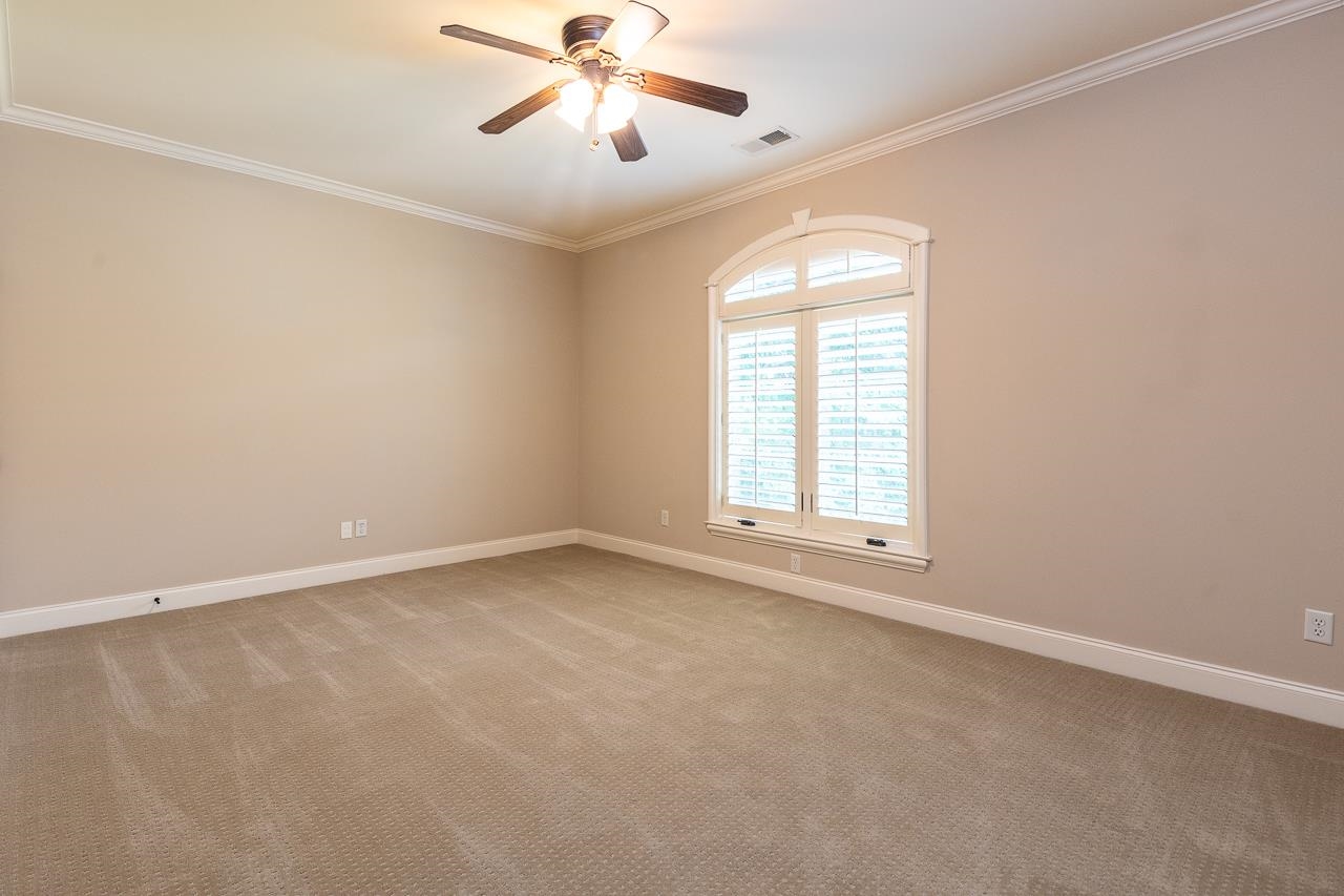 4600 Maple Glen Court Lakeland, TN 38002 - Photo 30 of 40 an empty room with windows and fan