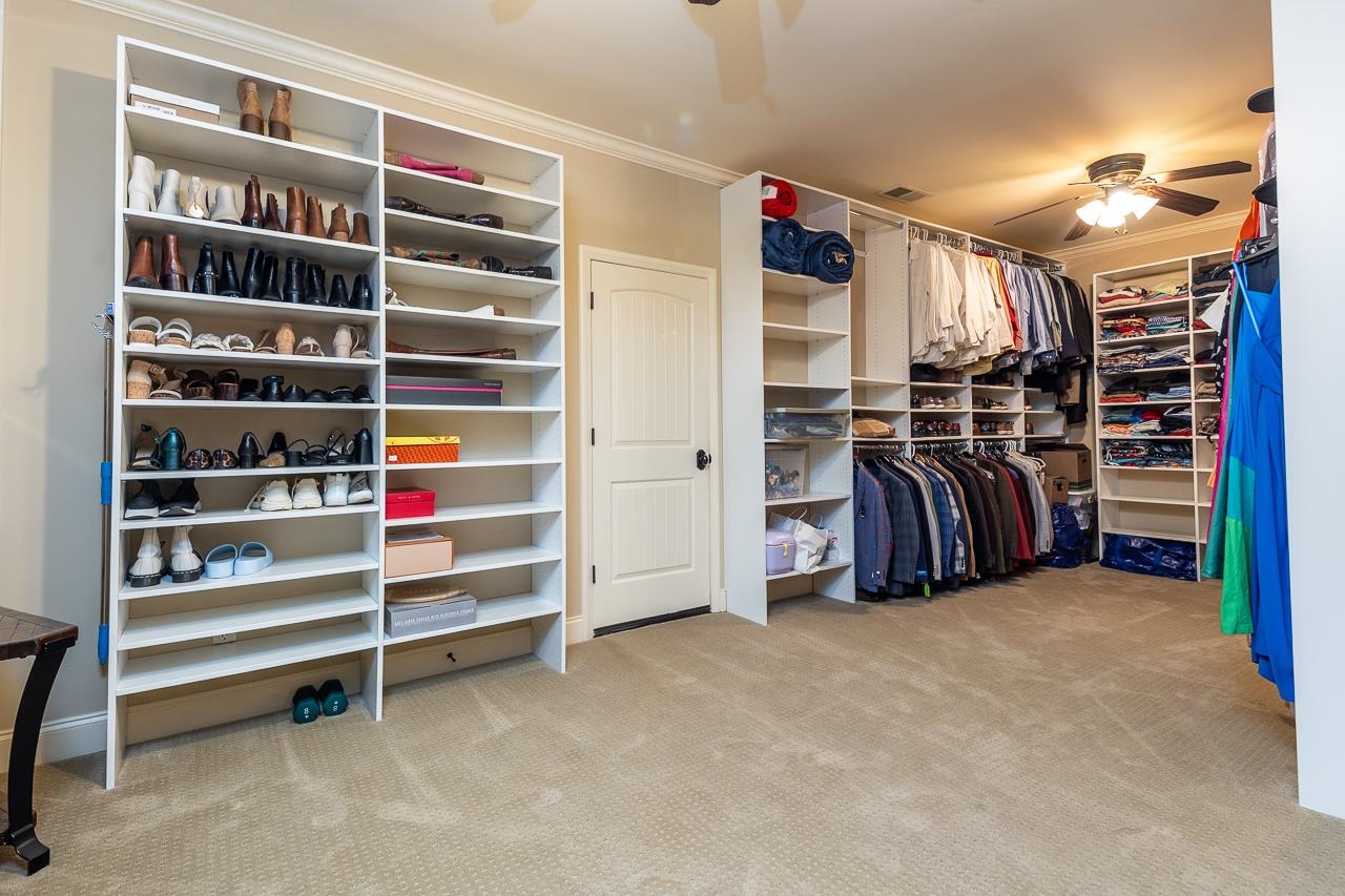 4600 Maple Glen Court Lakeland, TN 38002 - Photo 32 of 40 a view of walk in closet with clothes and shoes