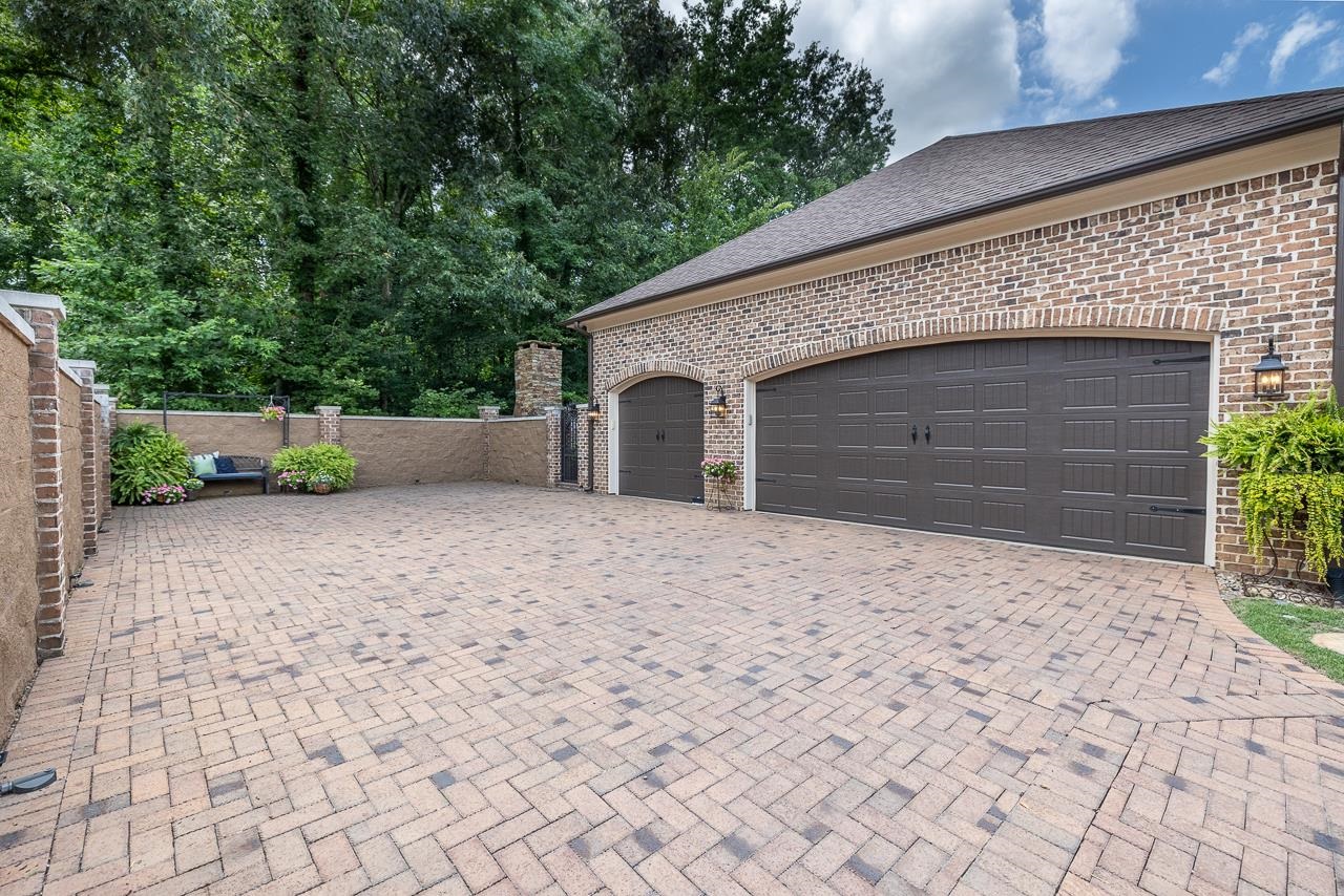 4600 Maple Glen Court Lakeland, TN 38002 - Photo 37 of 40 a front view of a house with a yard and a garage