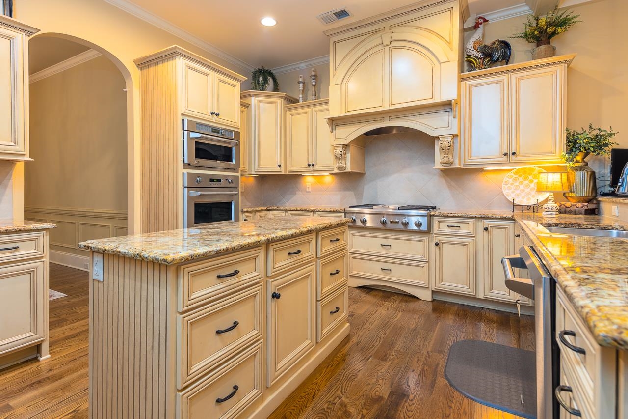 4600 Maple Glen Court Lakeland, TN 38002 - Photo 8 of 40 a kitchen with stainless steel appliances granite countertop a stove and a refrigerator