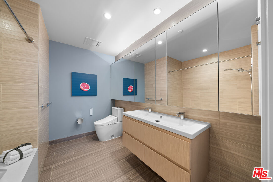 877 Francisco Street, Unit 1906 Los Angeles, CA 90017 - Photo 12 of 31 a bathroom with a toilet a sink and a shower