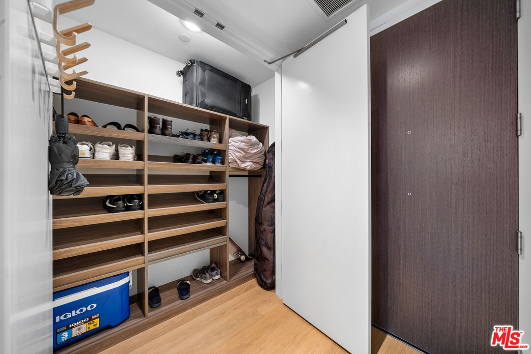 877 Francisco Street, Unit 1906 Los Angeles, CA 90017 - Photo 13 of 31 a view of walk in closet with empty racks