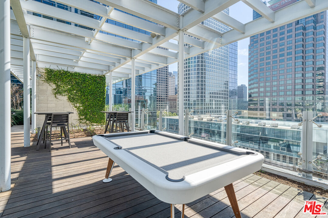 877 Francisco Street, Unit 1906 Los Angeles, CA 90017 - Photo 23 of 31 a view of a patio with a table and chairs