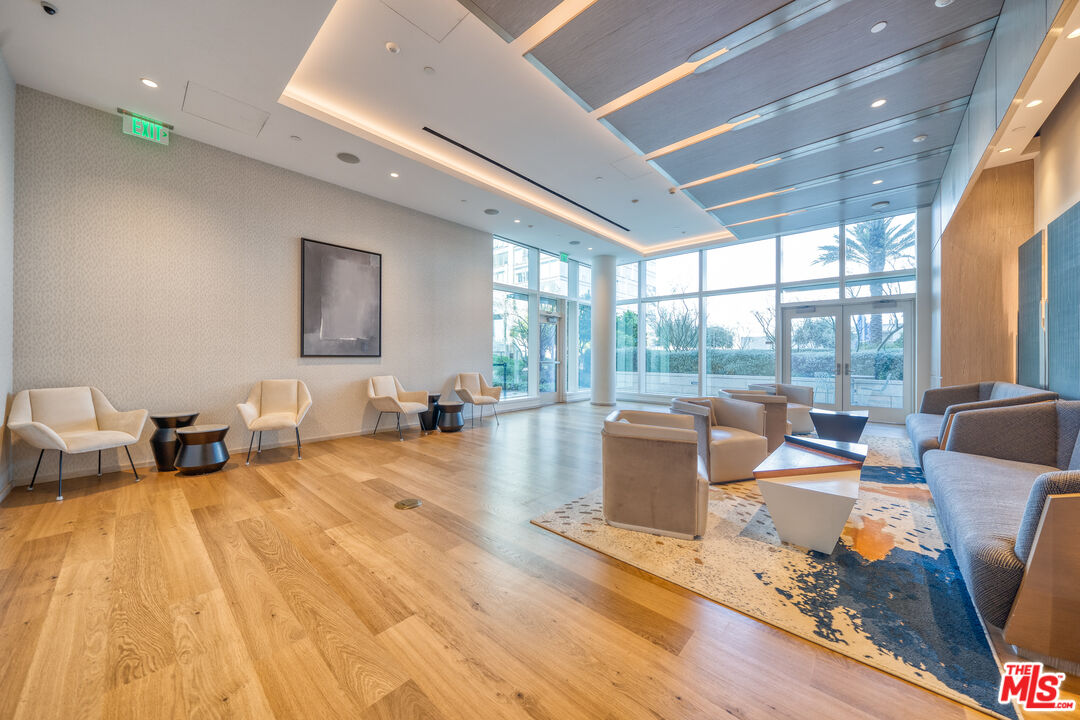 877 Francisco Street, Unit 1906 Los Angeles, CA 90017 - Photo 29 of 31 a living room with furniture and a large window