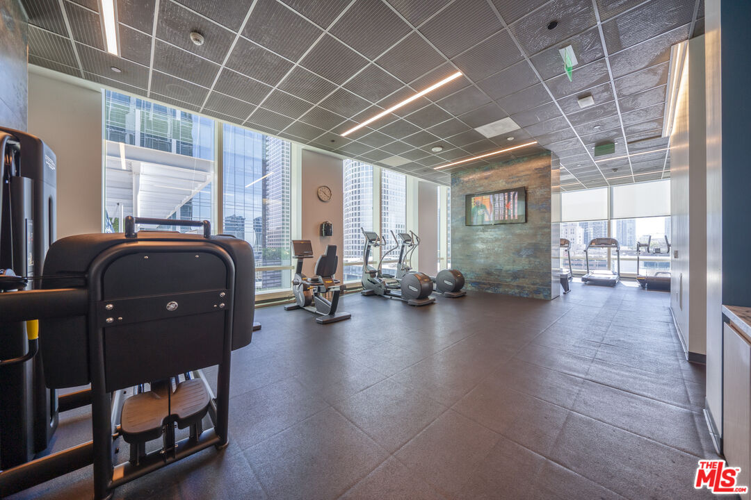 877 Francisco Street, Unit 1906 Los Angeles, CA 90017 - Photo 30 of 31 a view of livingroom with furniture and wooden floor
