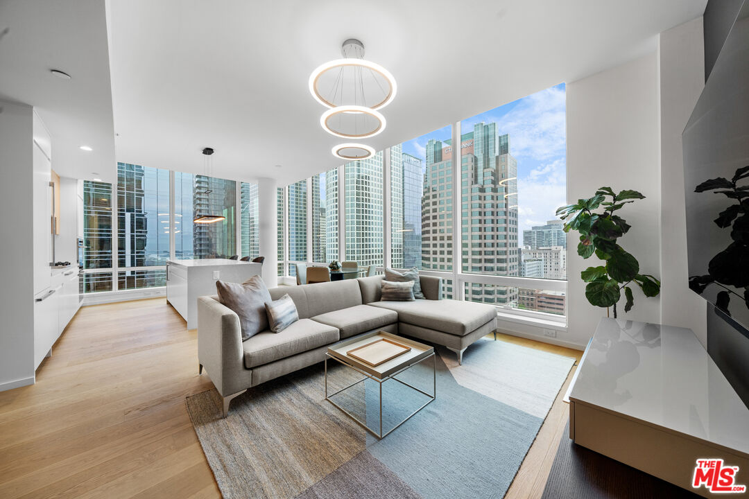 877 Francisco Street, Unit 1906 Los Angeles, CA 90017 - Photo 3 of 31 a living room with furniture and a large window