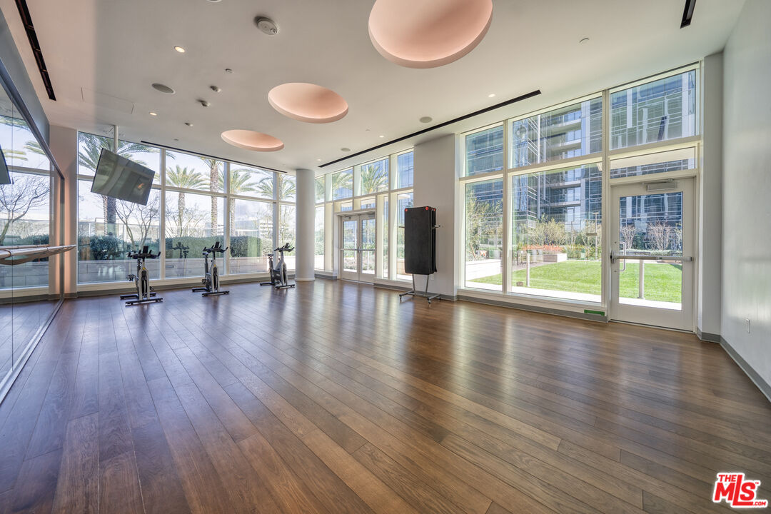 877 Francisco Street, Unit 1906 Los Angeles, CA 90017 - Photo 31 of 31 a view of an empty room with wooden floor and a window