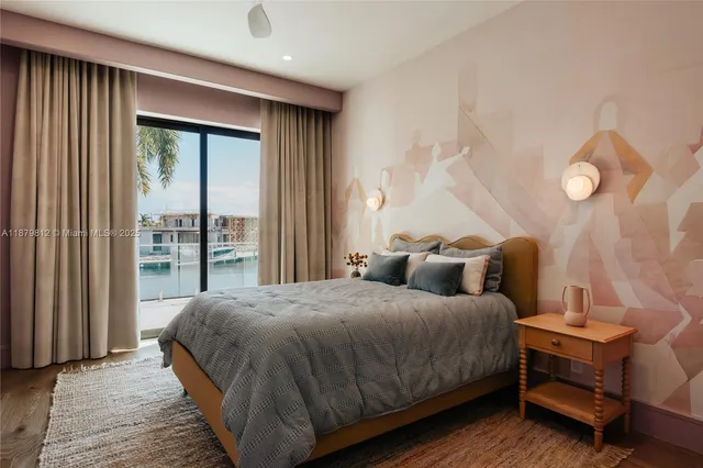 a living room with furniture a rug and wall paintings