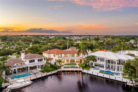a view of house with swimming pool and porch