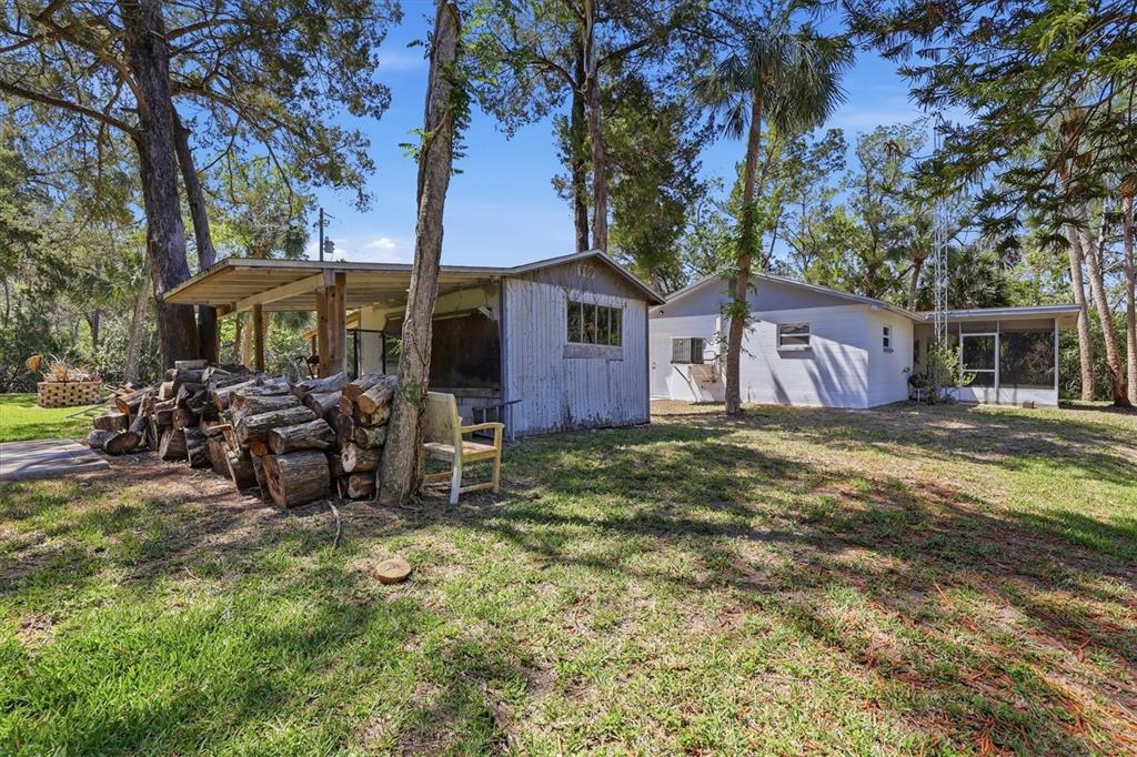 6244 Colony Circle Weeki Wachee, FL 34607 - Photo 6 of 60 a view of a house with backyard