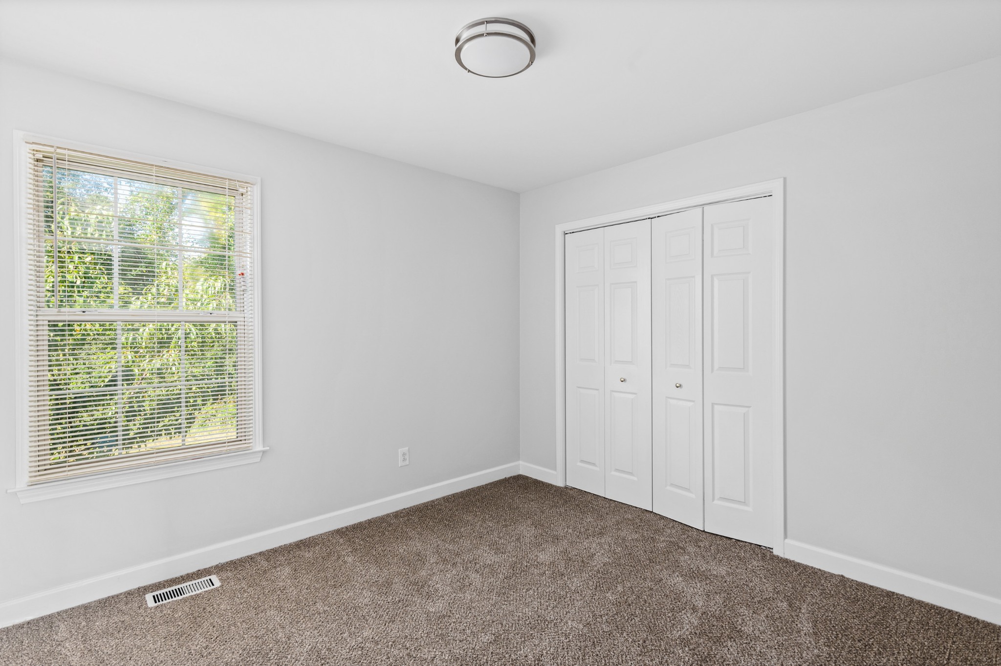 2849 Cochran Trace Drive Spring Hill, TN 37174 - Photo 13 of 27 an empty room with windows and closet