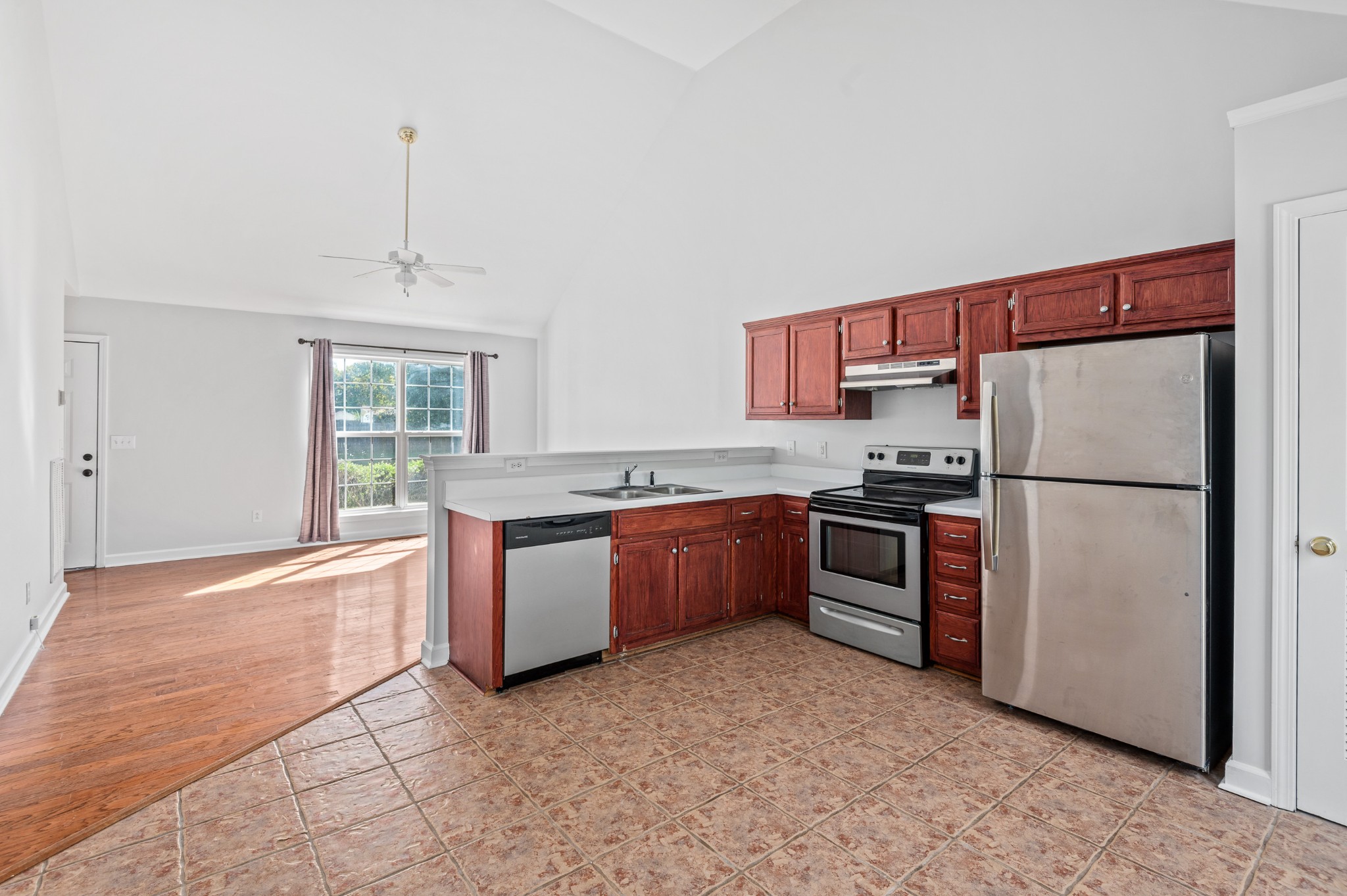 2849 Cochran Trace Drive Spring Hill, TN 37174 - Photo 9 of 27 a kitchen with stainless steel appliances granite countertop a refrigerator a sink and a stove