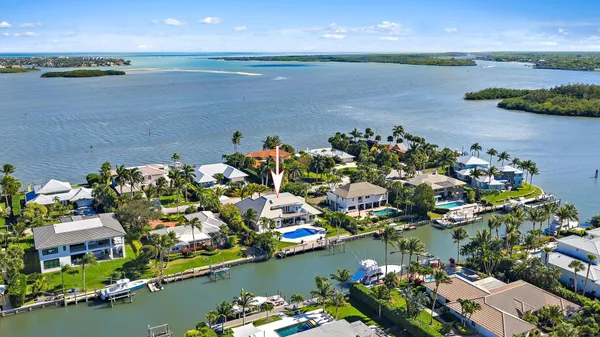 an aerial view of a house with a lake view