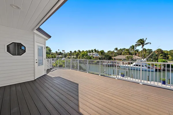 a view of balcony with wooden floor