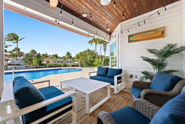 a dinning table and chairs in the patio