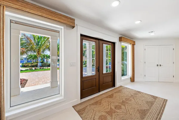 a view of an entryway with a carpet