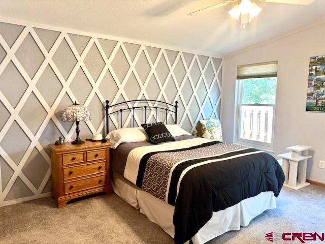 802 Bluffs Boulevard Cortez, CO 81321 - Photo 11 of 30 a bedroom with a bed and a cabinets