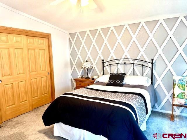 802 Bluffs Boulevard Cortez, CO 81321 - Photo 12 of 30 a bedroom with a bed and cabinets