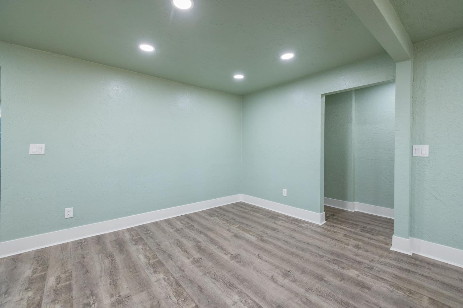 4722 East Florence Avenue Fresno, CA 93725 - Photo 13 of 51 an empty room with wooden floor and entrance