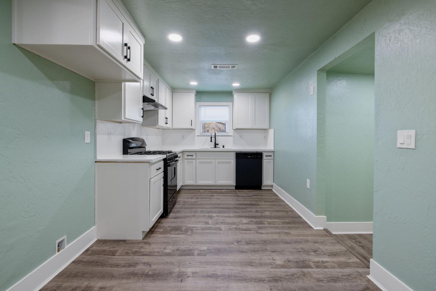 4722 East Florence Avenue Fresno, CA 93725 - Photo 17 of 51 a view of kitchen with wooden floor