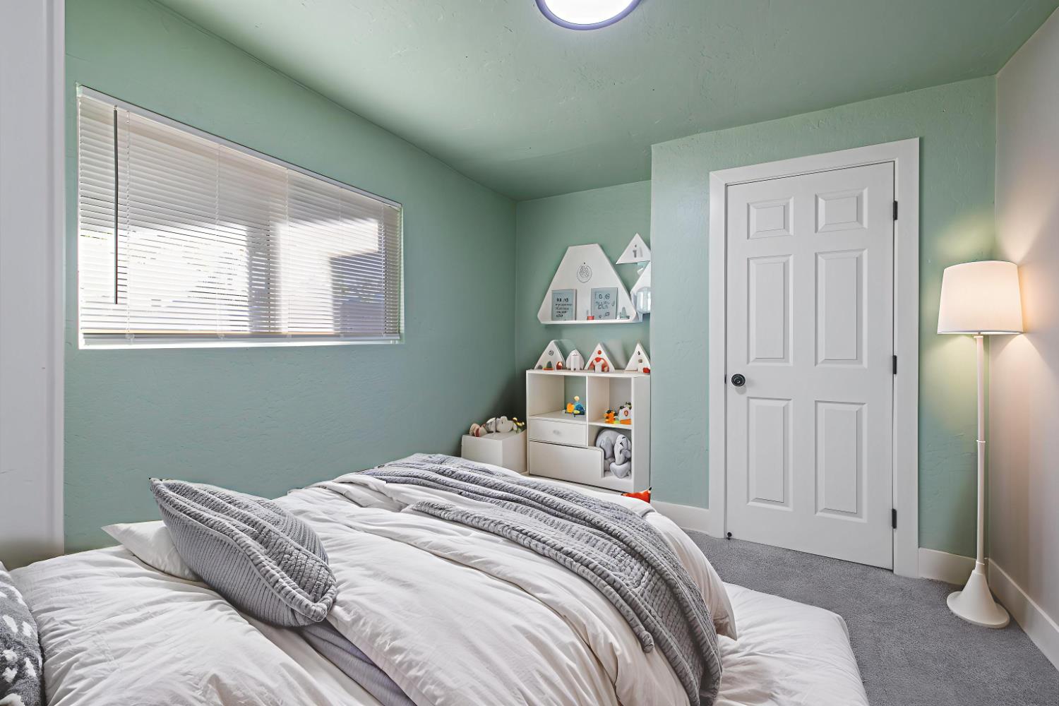 4722 East Florence Avenue Fresno, CA 93725 - Photo 21 of 51 a bedroom with a bed and a window