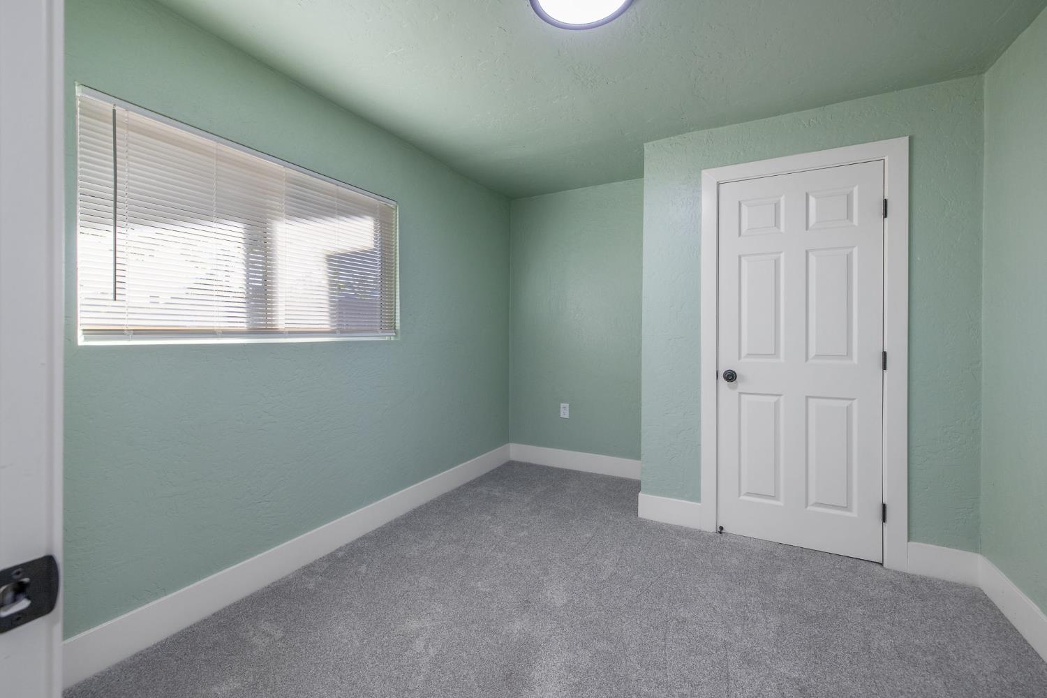 4722 East Florence Avenue Fresno, CA 93725 - Photo 22 of 51 an empty room with windows