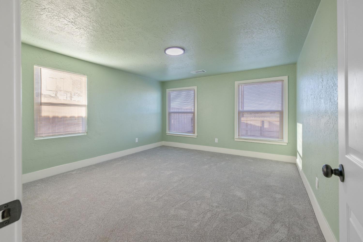 4722 East Florence Avenue Fresno, CA 93725 - Photo 31 of 51 an empty room with windows