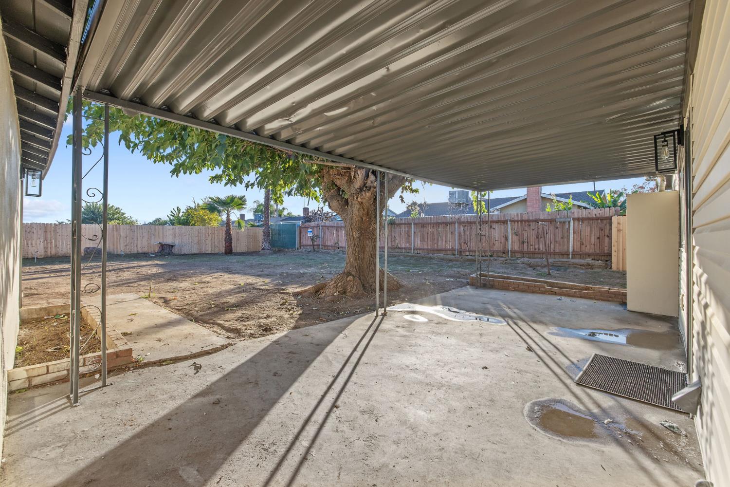 4722 East Florence Avenue Fresno, CA 93725 - Photo 37 of 51 a view of a backyard with a large tree